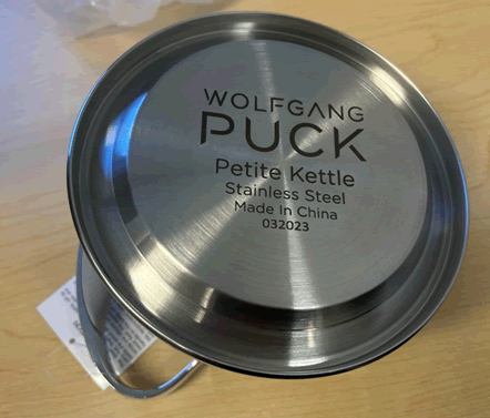 “Wolfgang Puck Petite Kettle” printed on the kettle’s underside
